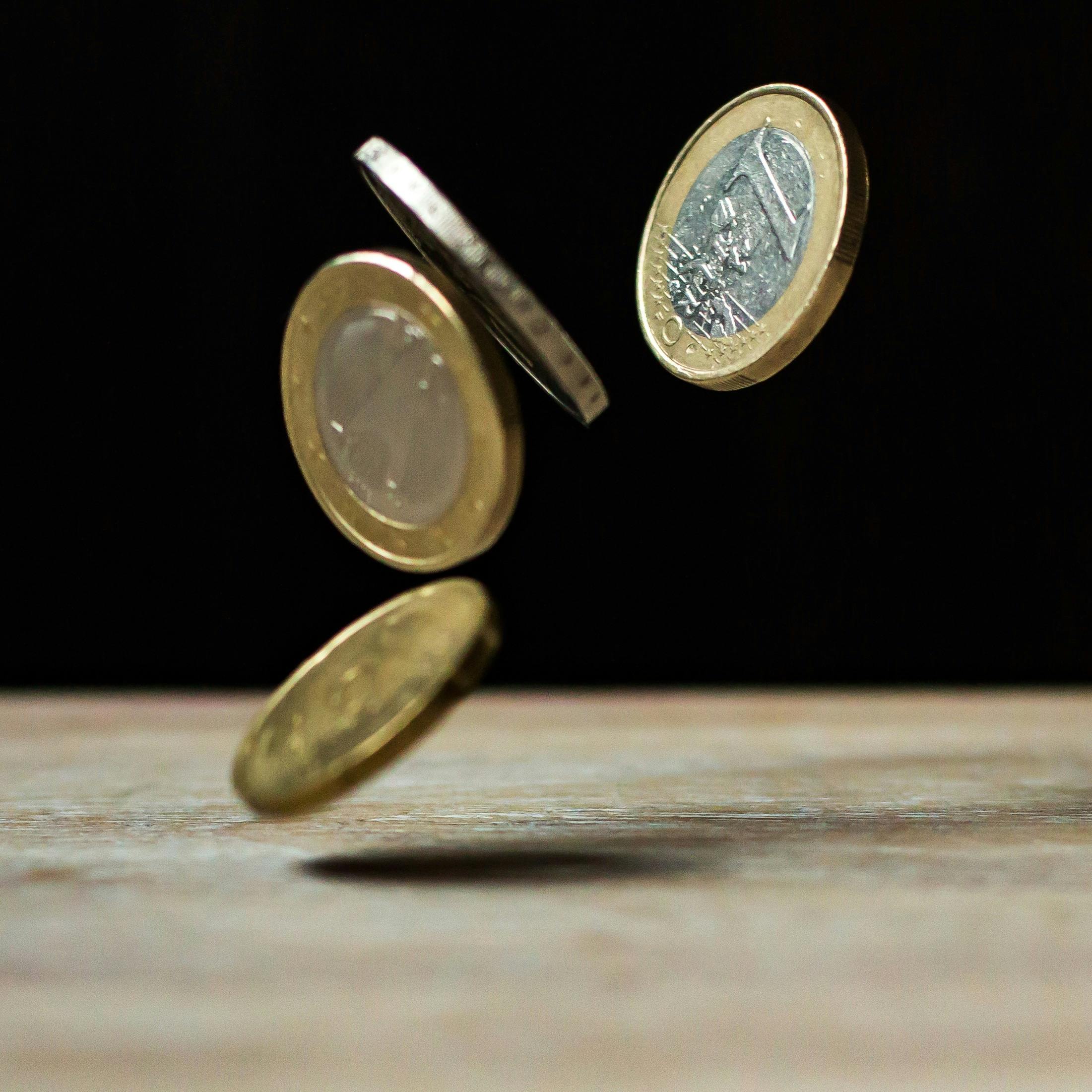 Water splash with coin representing cost impact